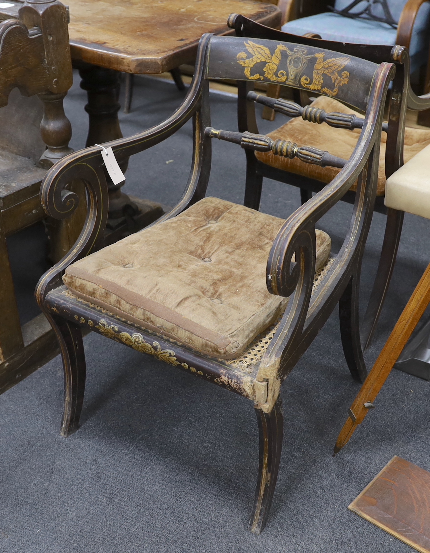 A set of eight Regency painted cane seat dining chairs, two with arms (in need of restoration)